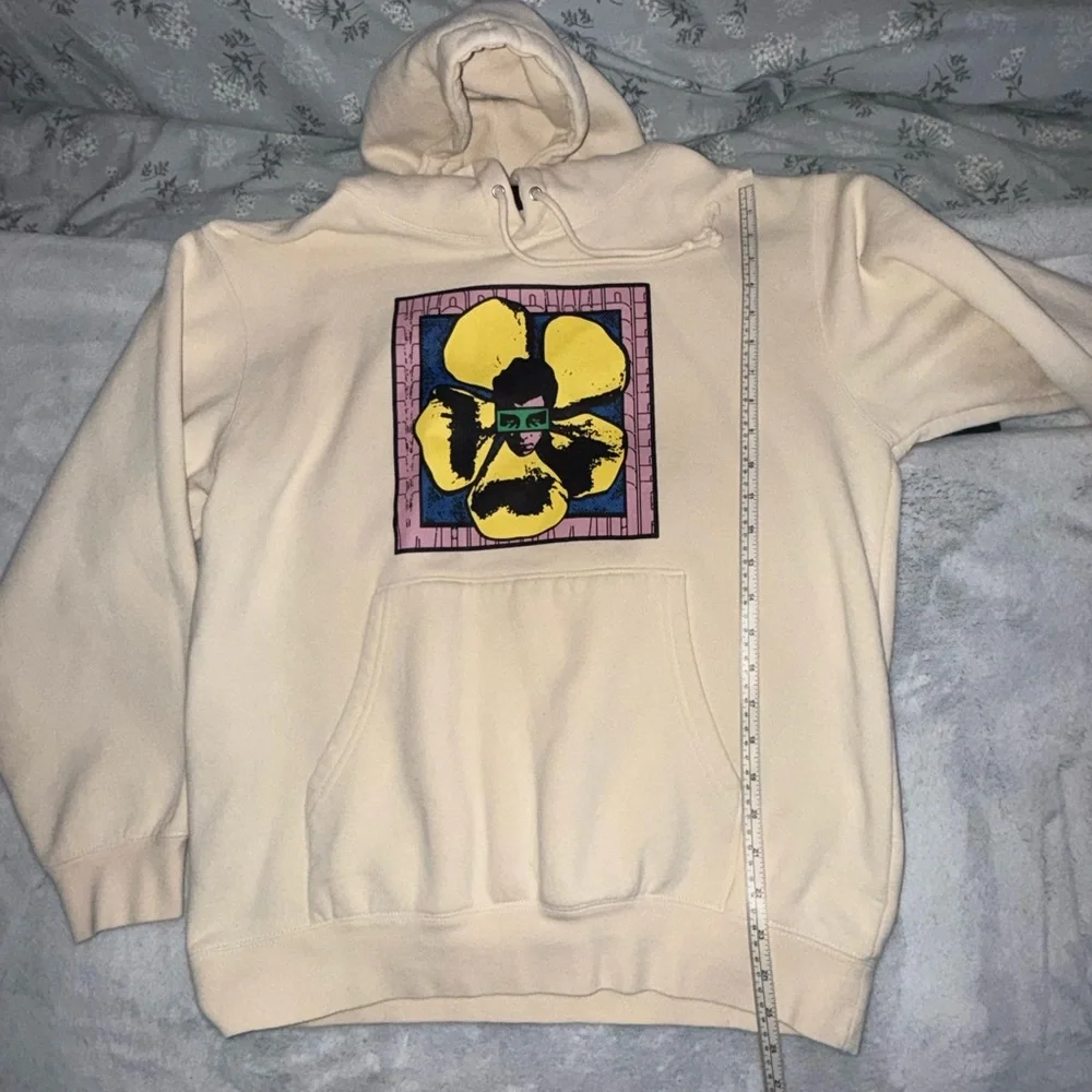 Obey Cream Hoodie with Yellow Flower Graphic